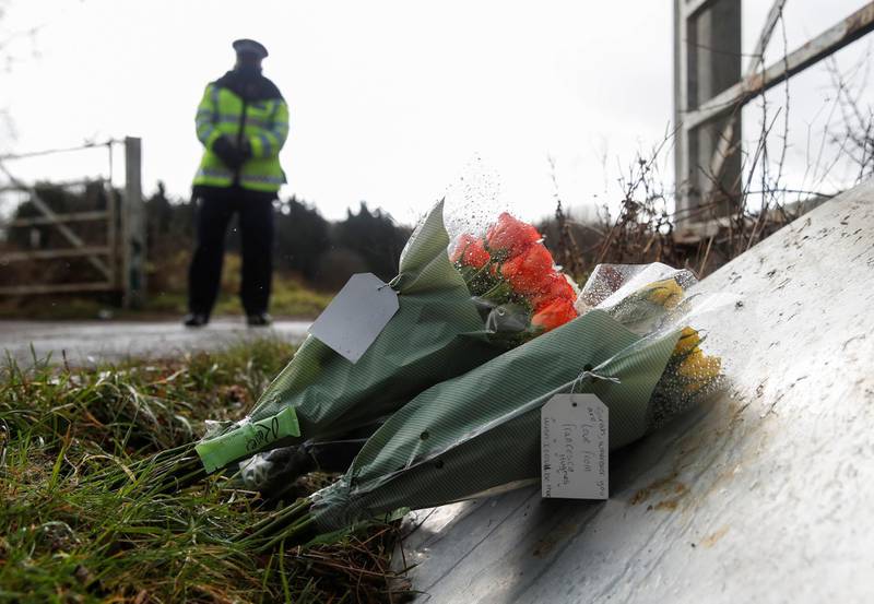 Flowers placed by police officers at the golf course entrance are pictured, as the investigation into the disappearance of Sarah Everard continues, in Ashford, Britain, March 11, 2021. REUTERS/Paul Childs