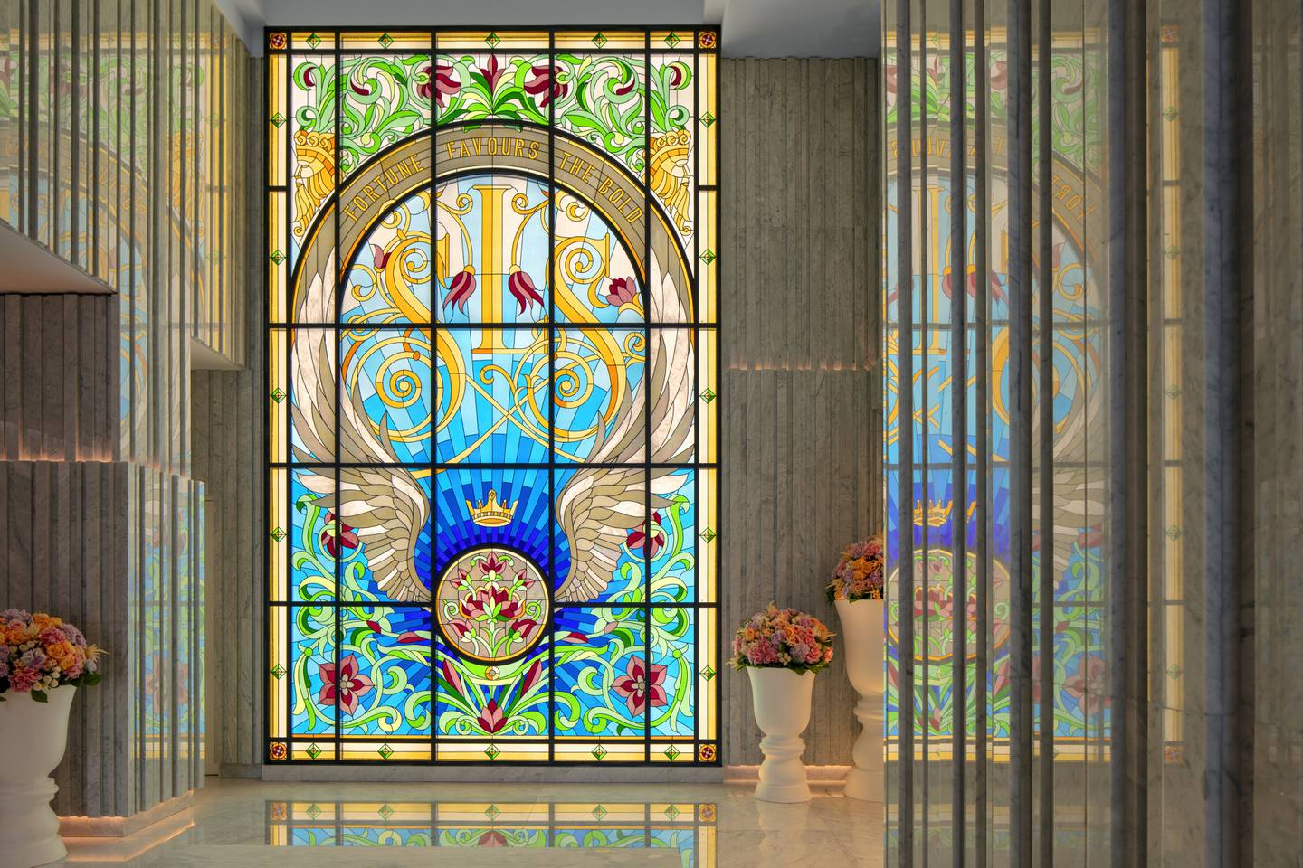 The lobby of the SLS Dubai is home to an oversized stained glass window emblazoned with the brand name and the proverb 'fortune favours the bold'