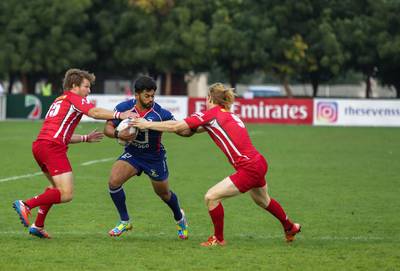 Jebel Ali Dragons, blue, pictured in action against Bahrain in January. Victor Besa for The National