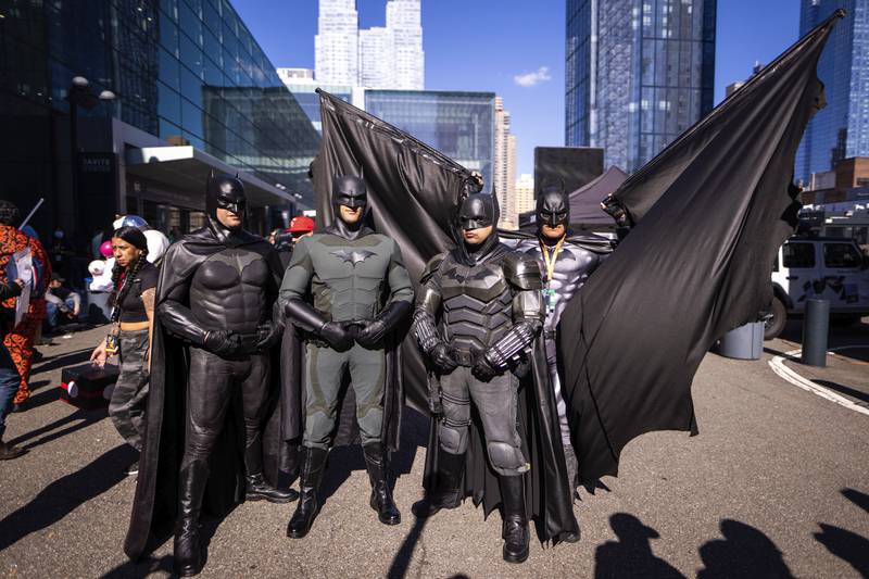 Batman cosplayers pose together. AP Photo