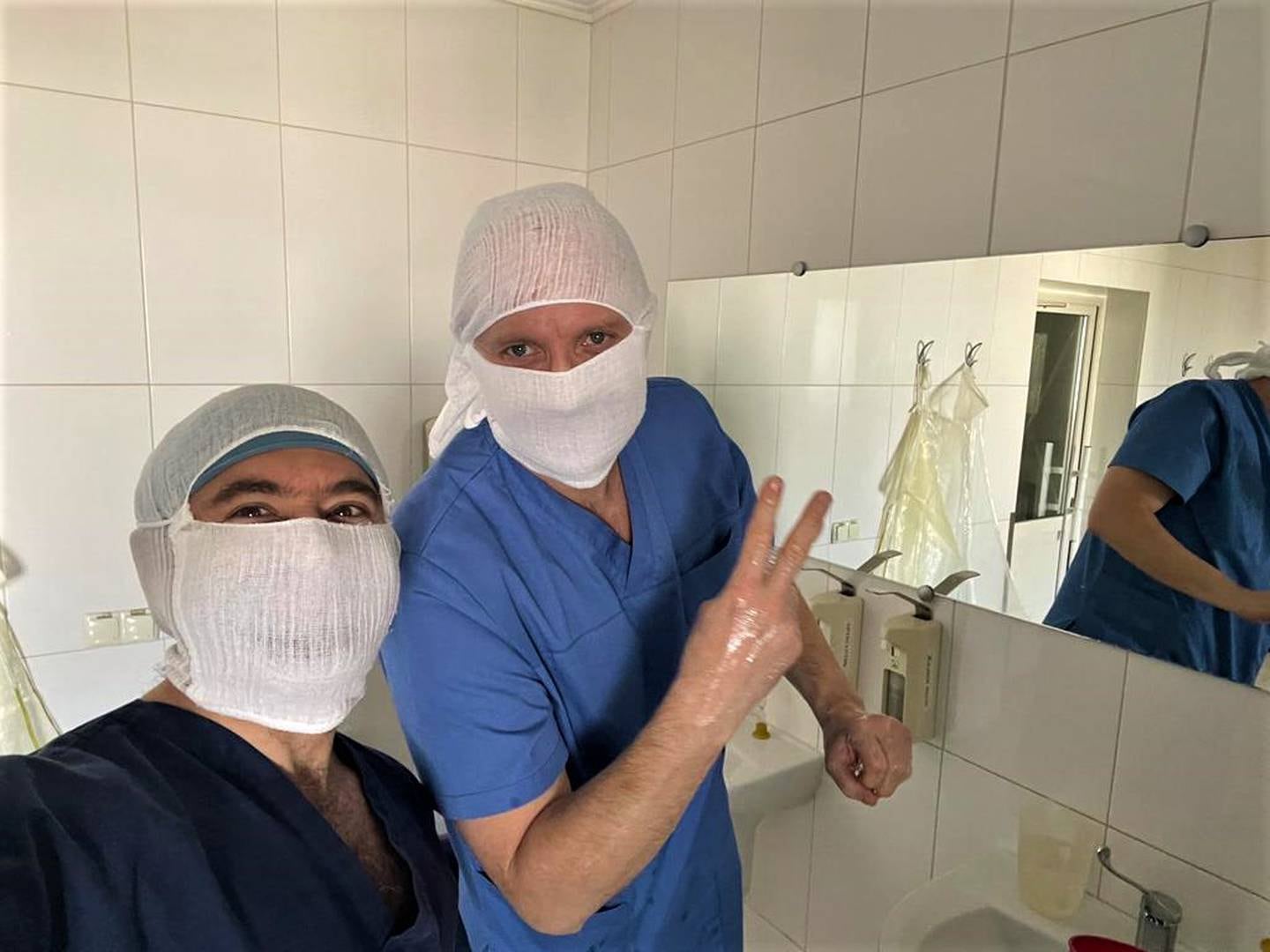 Doctors scrubbing in for surgery. Photo: Dr Mohamed Tennari