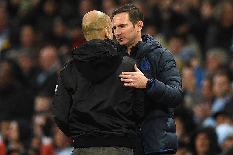 Manchester City's Spanish manager Pep Guardiola (L) speaks with Chelsea's English head coach Frank Lampard. AFP