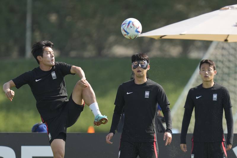 South Korea's Son Heung-min, centre, Hong Chul, left, and Son Jun-ho during training on Sunday. AP