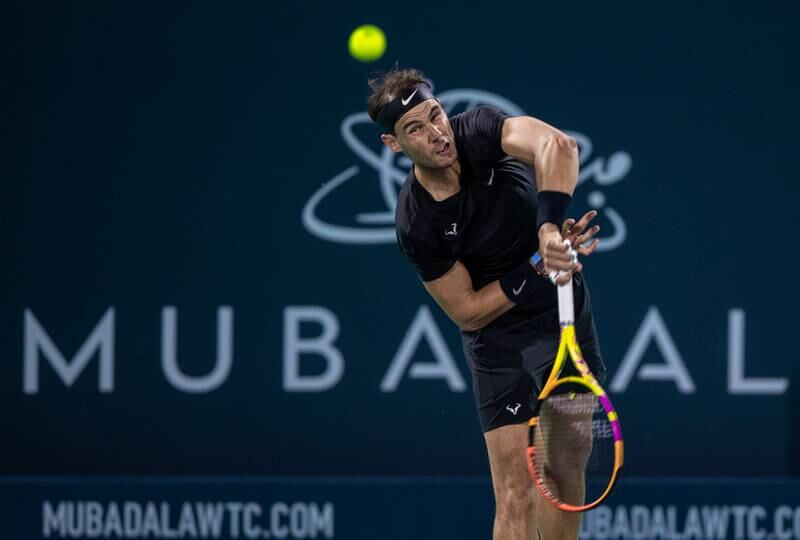 Rafael Nadal hits a serve to Andy Murray at the Mubadala World Tennis Championship. Victor Besa / The National