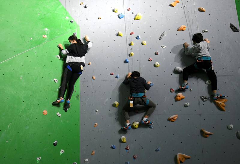 Abu Dhabi, United Arab Emirates - The family scales the indoor climbing walls together at CLYMB, Yas Island. Khushnum Bhandari for The National