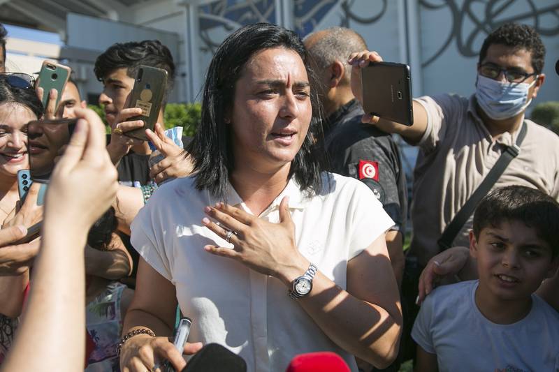 Jabeur is greeted as she arrives at Tunis airport. AP
