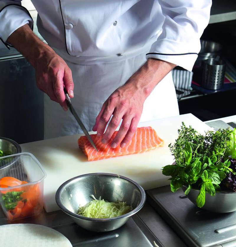 Chef Cutting salmon fish (iStockphoto.com)