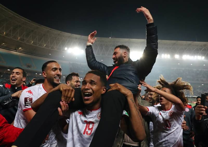 Players of Tunisia celebrate after winning the World Cup 2022 Africa qualifiers play-off. EPA