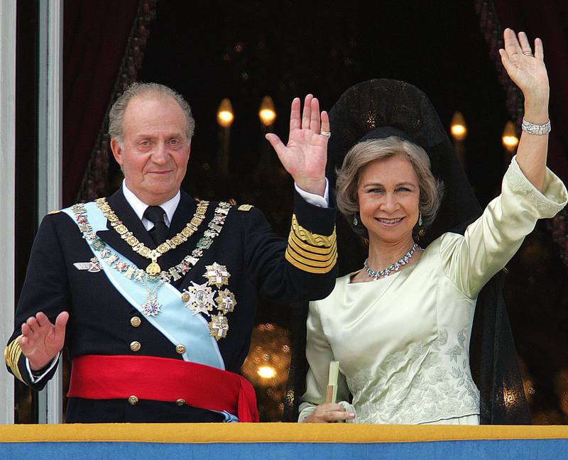 A 2004 image of Juan Carlos of Spain and his wife Queen Sofia of Spain on the balcony of the Oriental Palace in Madrid. AFP