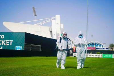 Workers in PPE disinfecting the practice area at Abu Dhabi Cricket in order for Mumbai Indians and Kolkata Knight Riders to train ahead of the IPL. Courtesy Abu Dhabi Cricket