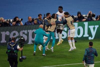 Real Madrid's Vinicius Junior celebrates with teammates after scoring. PA