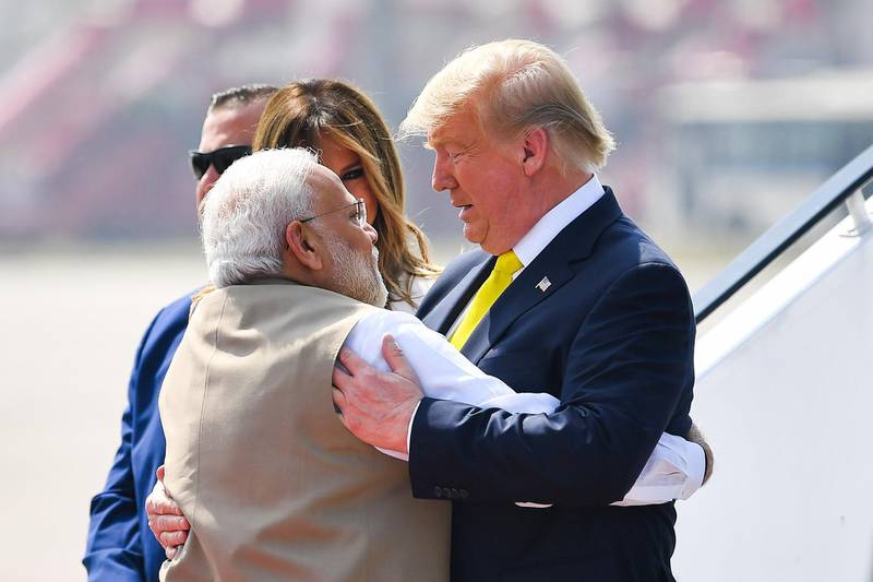 India's Prime Minister Narendra Modi embraces US President Donald Trump upon his arrival at Sardar Vallabhbhai Patel International Airport in Ahmedabad.  AFP