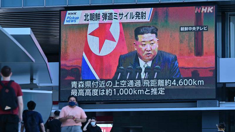A screen shows images of North Korea's leader Kim Jong-un during a news update in Tokyo. North Korea fired a missile over Japan for the first time in five years on October 4. AFP