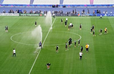 Sprinklers are turned on in the middle of the pitch during an Inter Milan training session at Ataturk Olympic Stadium in Istanbul. PA 
