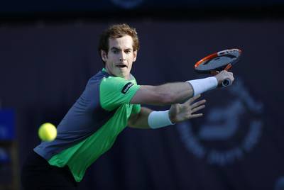 Andy Murray returns a shot to Gilles Muller during his first round win on Tuesday at the Dubai Duty Free Tennis Championships. Ahmed Jadallah / Reuters