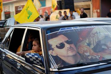 Syrian President Bashar Al Assad is seen on a car's windscreen as Hezbollah supporters celebrate, after the Syrian army took control of Qusair from rebel fighters, in the Shi'ite town of Hermel June 5, 2013. Reuters
