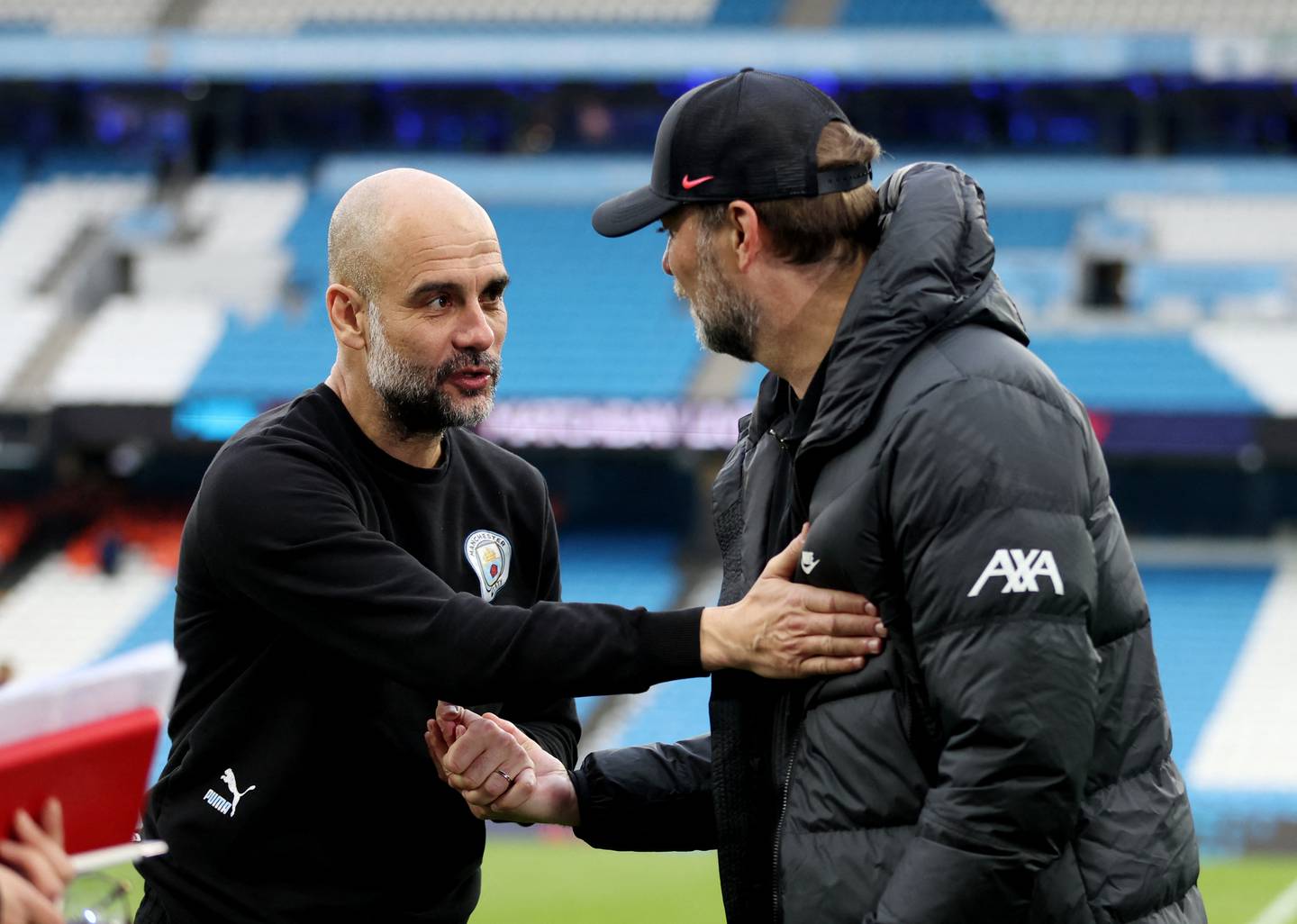 Manchester City coach Pep Guardiola with Liverpool manager Jurgen Klopp after the match. Action Images