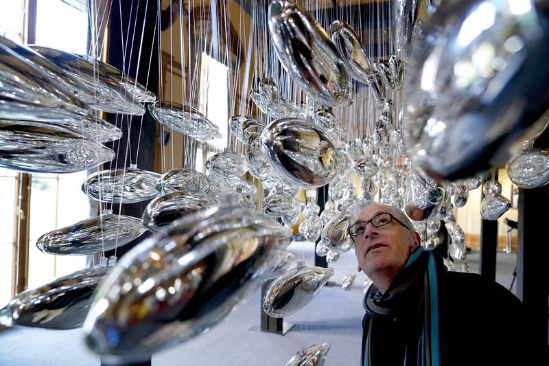 Artist Joseph Rossano views his art installation 'The Salmon School' on Wednesday. It is on display in the Castle Ballroom at the opening of Life at Balmoral, the Platinum Jubilee exhibition at Balmoral Castle, in Royal Deeside, Aberdeenshire. PA