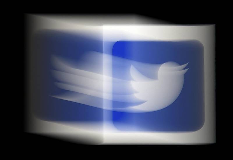 (FILES) In this file photo illustration, a Twitter logo is displayed on a mobile phone on August 10, 2020, in Arlington, Virginia.  Twitter on May 4, 2021 said it is buying Scroll and its ad-free news app to bolster a coming subscription service, and channel money to journalism in the process.The global one-to-many messaging platform did not disclose how much it is paying for Scroll, which owns the Nuzzel app."Scroll will become a meaningful addition to our subscriptions work as we build and shape a future subscription service on Twitter," Twitter product manager Mike Park said in a blog post. / AFP / Olivier DOULIERY
