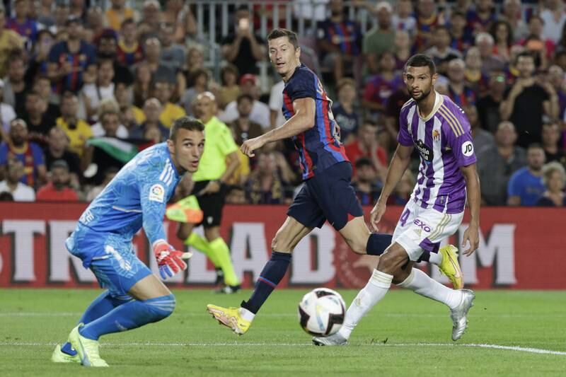 Robert Lewandowski scores Barcelona's third goal against Real Valladolid. EPA