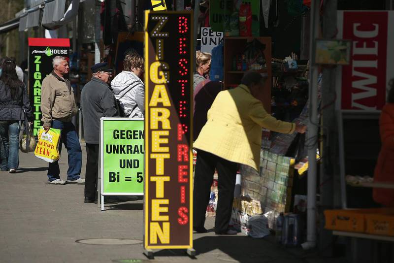 Visitors shop for cigarettes and other items that are cheaper than in Germany at an outdoor market near the German-Polish border. Sean Gallup / Getty Images