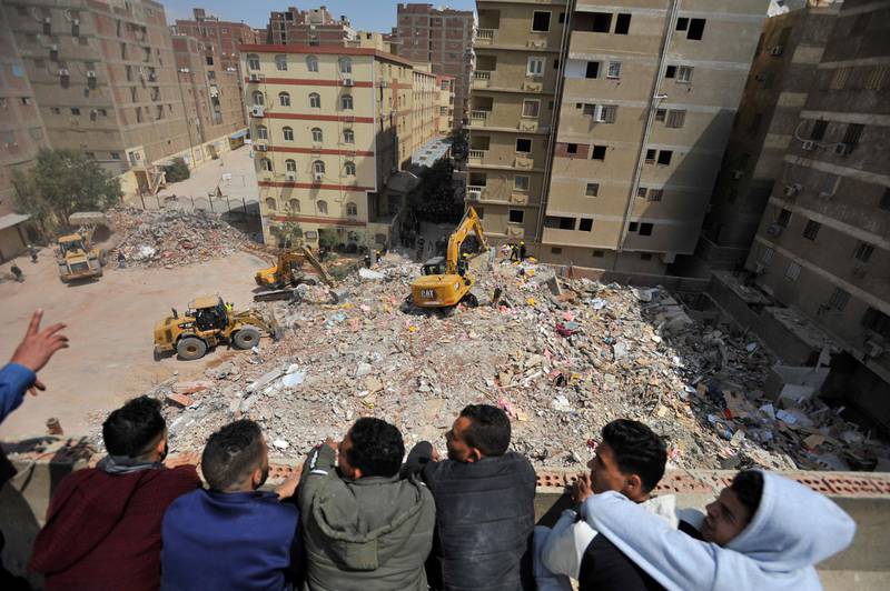 Rescuers work at the site where a building collapsed in Gesr al-Suez, Cairo. Reuters
