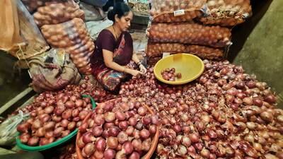 An onion trader in Thane, India. Getty Images