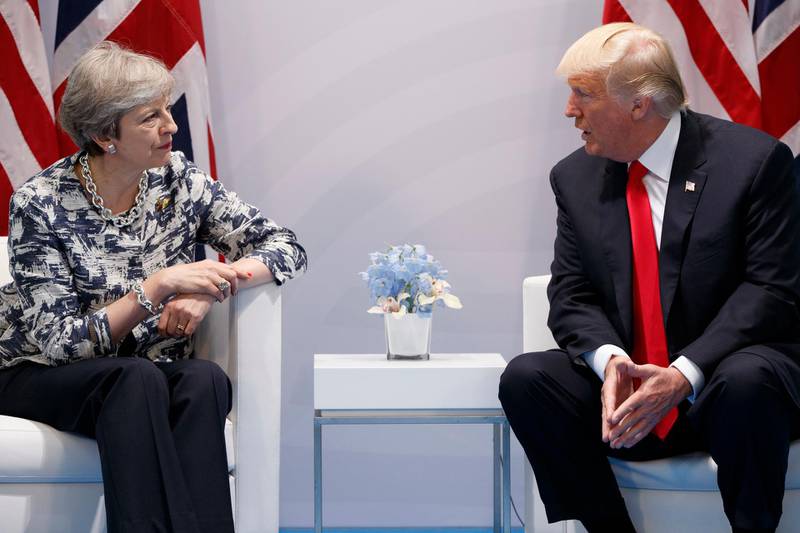 British Prime Minister Theresa May and US President Donald Trump met when he visited the UK last July. AP
