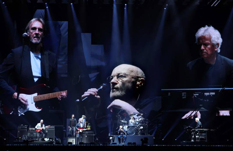 From left, Mike Rutherford, Phil Collins and Tony Banks, members of British rock band Genesis, perform at a concert in Nanterre, France. AFP
