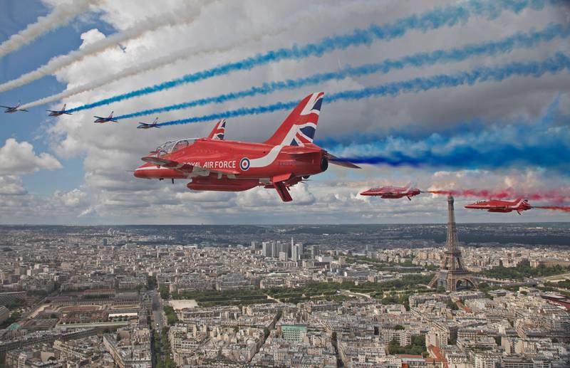 The Royal Air Force Aerobatic Team, the Red Arrows, and the Patrouille De France carry out joint flypasts of both Paris and London. EPA