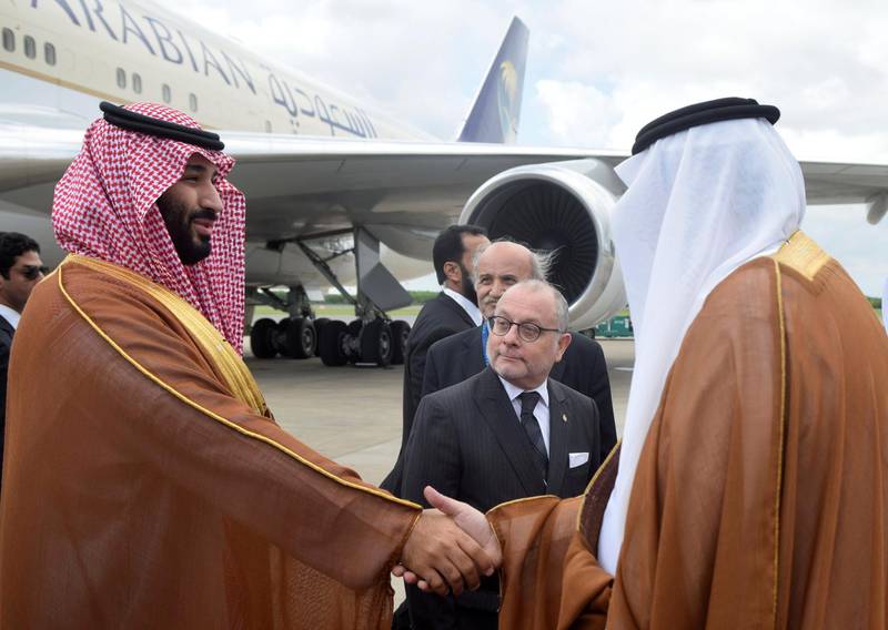 Saudi Arabia's Crown Prince Mohammed bin Salman shakes hands with a Saudi Arabia's embassy official as Argentine Foreign Minister Jorge Faurie watches, at Ministro Pistarini in Buenos Aires, Argentina, November 28, 2018. Argentine G20/Handout via REUTERS ATTENTION EDITORS - THIS IMAGE WAS PROVIDED BY A THIRD PARTY.