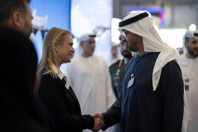 President Sheikh Mohamed greets an exhibitor. Hamad Al Kaabi / UAE Presidential Court