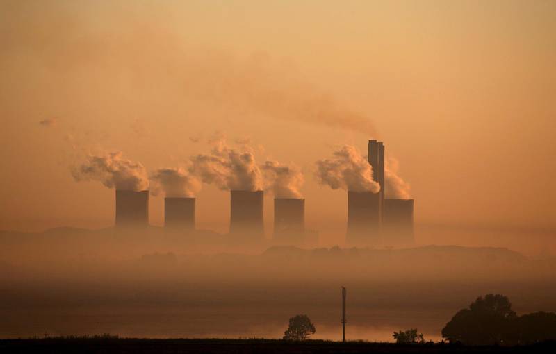 FILE PHOTO: Steam rises at sunrise from the  Lethabo Power Station, a coal-fired power station owned by state power utility ESKOM near Sasolburg, South Africa, March 2, 2016. Picture taken March 2, 2016. REUTERS/Siphiwe Sibeko/File Photo /File Photo/File Photo