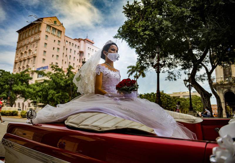 A bride rides in a classic American car in Havana, Cuba. AFP