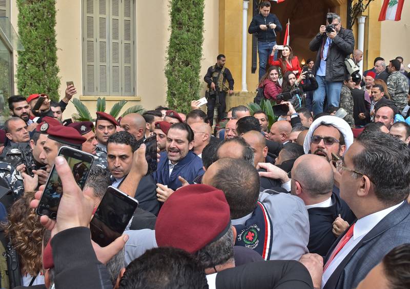 Greeting supporters upon arrival at his home in Beirut, in 2017, after a mysterious odyssey that resulted in him announcing his resignation while in Saudi Arabia. Hariri told cheering supporters that he was staying.