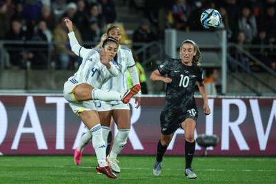 Philippines midfielder Jaclyn Sawicki, left, fights for the ball with New Zealand's 10 Annalie Longo. AFP