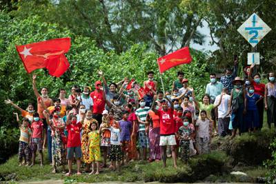 NLD supporters greet to a boat rally. Reuters