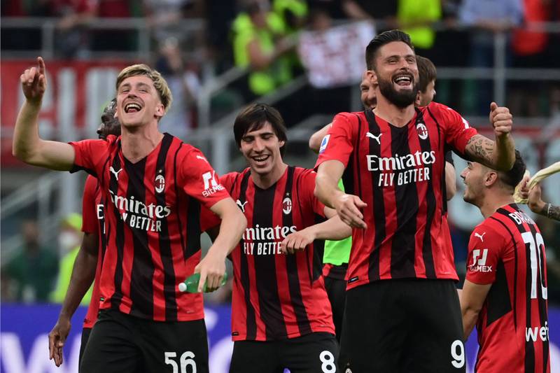 Olivier Giroud, right, celebrates with his AC Milan teammates after their 2-0 Serie A win over Atalanta at the San Siro on May 15, 2022. AFP