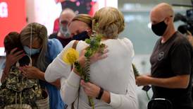 Tearful reunions as Australia's border reopens after 600 days