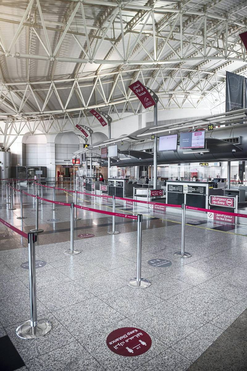 Floor markers and barriers are designed to ensure social distancing throughout the airport.