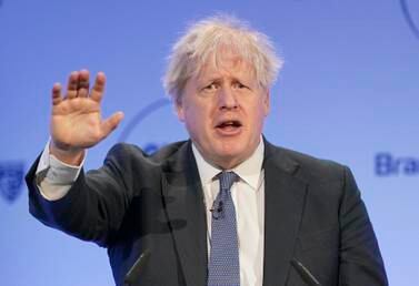 Former British Prime Minister Boris Johnson speaks during the Global Soft Power Summit, at the Queen Elizabeth II Conference Centre in London, Thursday March 2, 2023.  Johnson on Thursday poured cold water on current premier Rishi Sunak’s new Brexit deal with the European Union, saying he would “find it hard” to vote for it in Parliament.  (Jonathan Brady / PA via AP)