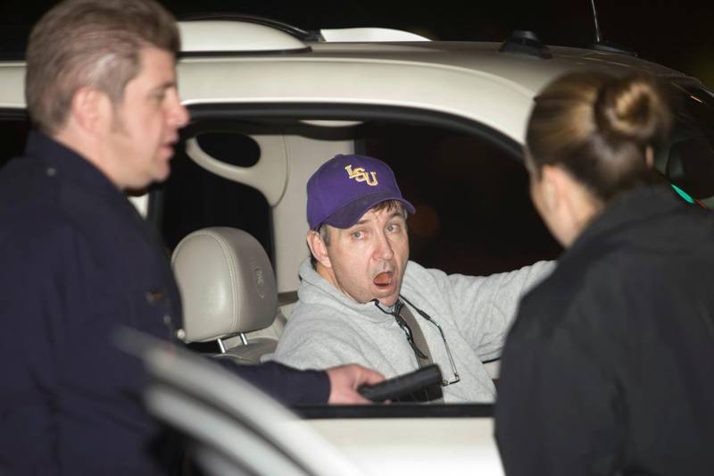FILE PHOTO: Jamie Spears, the father of pop singer Britney Spears, talks with two police officers at the entrance of the Cedars Sinai Hospital in Beverly Hills, California, January 4, 2008. REUTERS/Hector Mata/File Photo