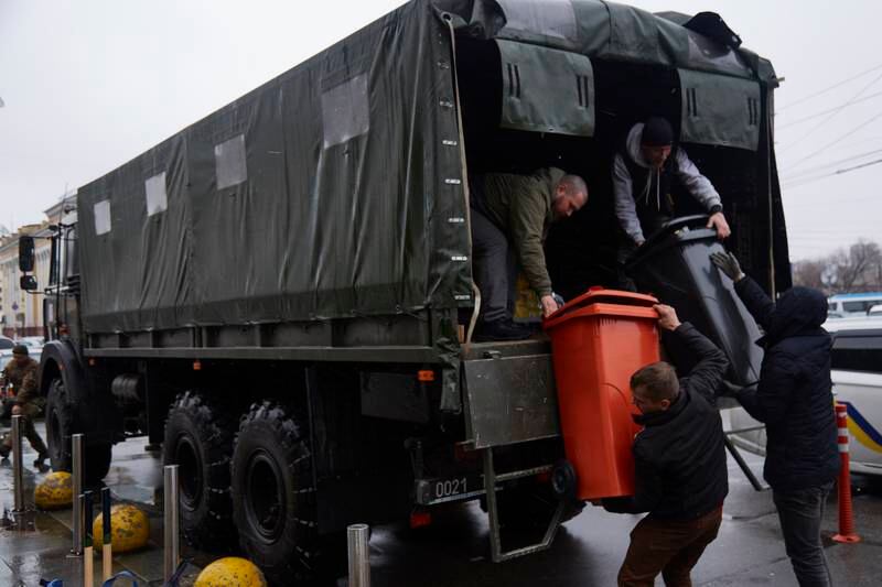 Volunteers unload supplies from a military truck in Kyiv, Ukraine. Getty Images