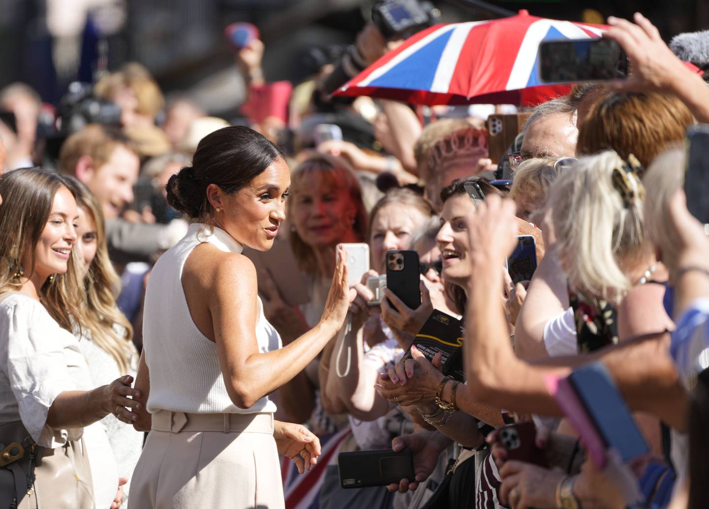 Meghan, Duchess of Sussex, meets fans after a visit to the town hall in Dusseldorf. AP