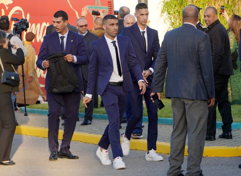 Morocco's Abderrazak Hamdallah and teammates arrive at the airport before their bus parade. Reuters