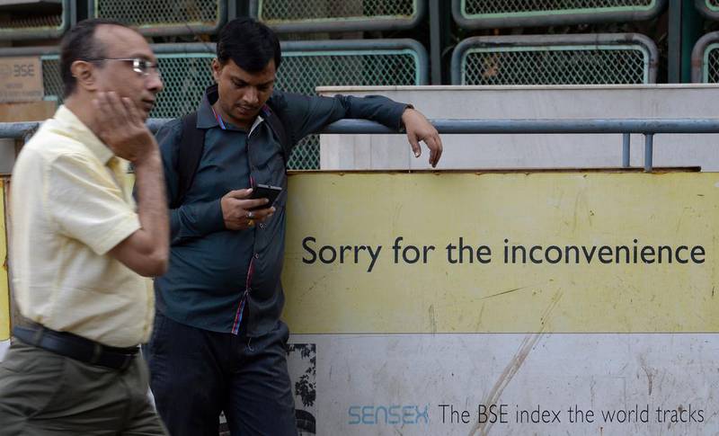 An Indian onlooker checking his mobile phone. The country has 200 million active WhatsApp users, and at least 300 million Indians use smartphones that support the popular messaging service and more than a billion people own mobile phones that support basic text messaging. Indranil Mukherjee/AFP Photo