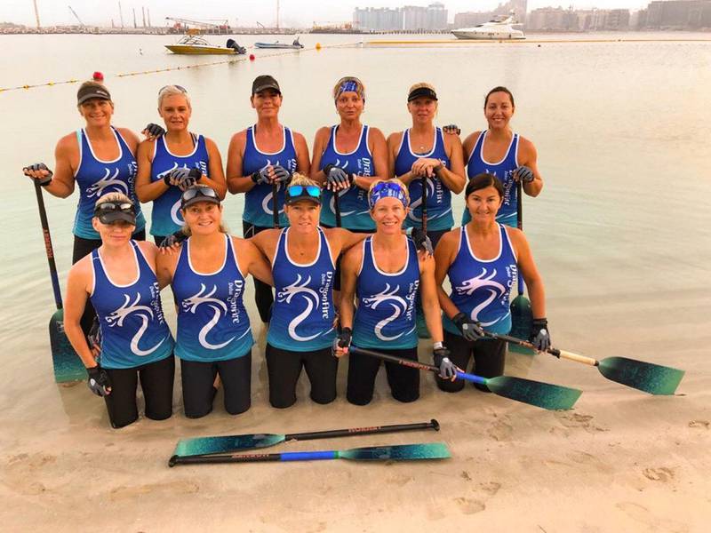 Vegan dragon boat athlete Joanne Owen, standing second from left, with her team, Dragonﬁre Dubai