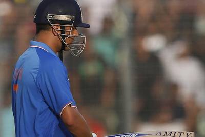 India captain MS Dhoni shown after being dismissed against Bangladesh on Sunday in his side's ODI loss in Dhaka. AM Ahad / AP / June 21, 2015