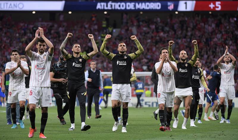 Sevilla players celebrate at the end of the match at Wanda Metropolitano stadium. AFP