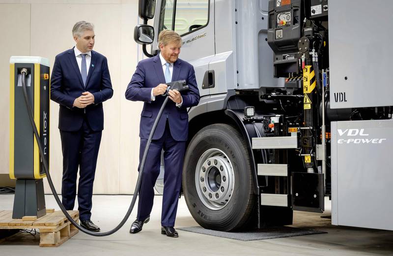 King Willem-Alexander of the Netherlands, right, charges an electric lorry at the opening of a test lab in Arnhem. AFP